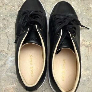 Cole Haan women’s Black Leather Sneakers with Cream Lining